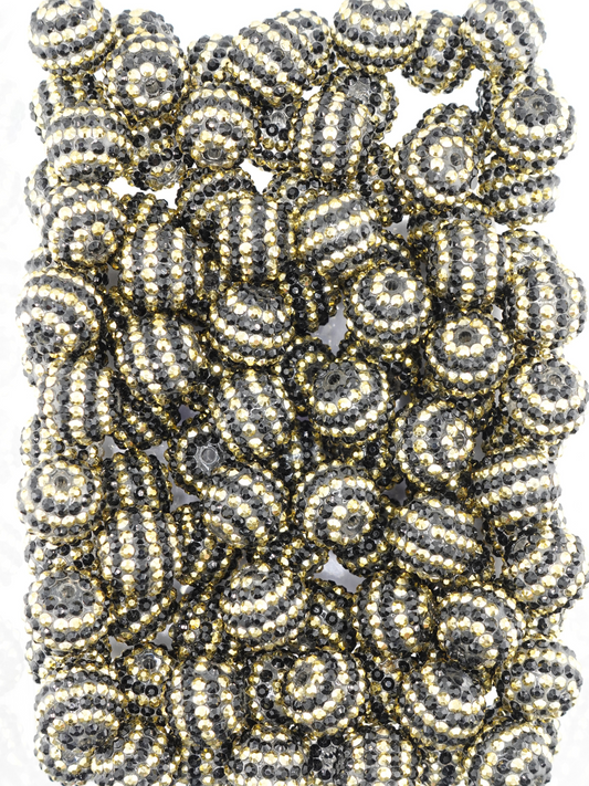 Collection of black and gold beads with a stripe design