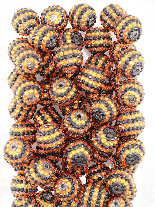Collection of black and orange beads with a stripe design