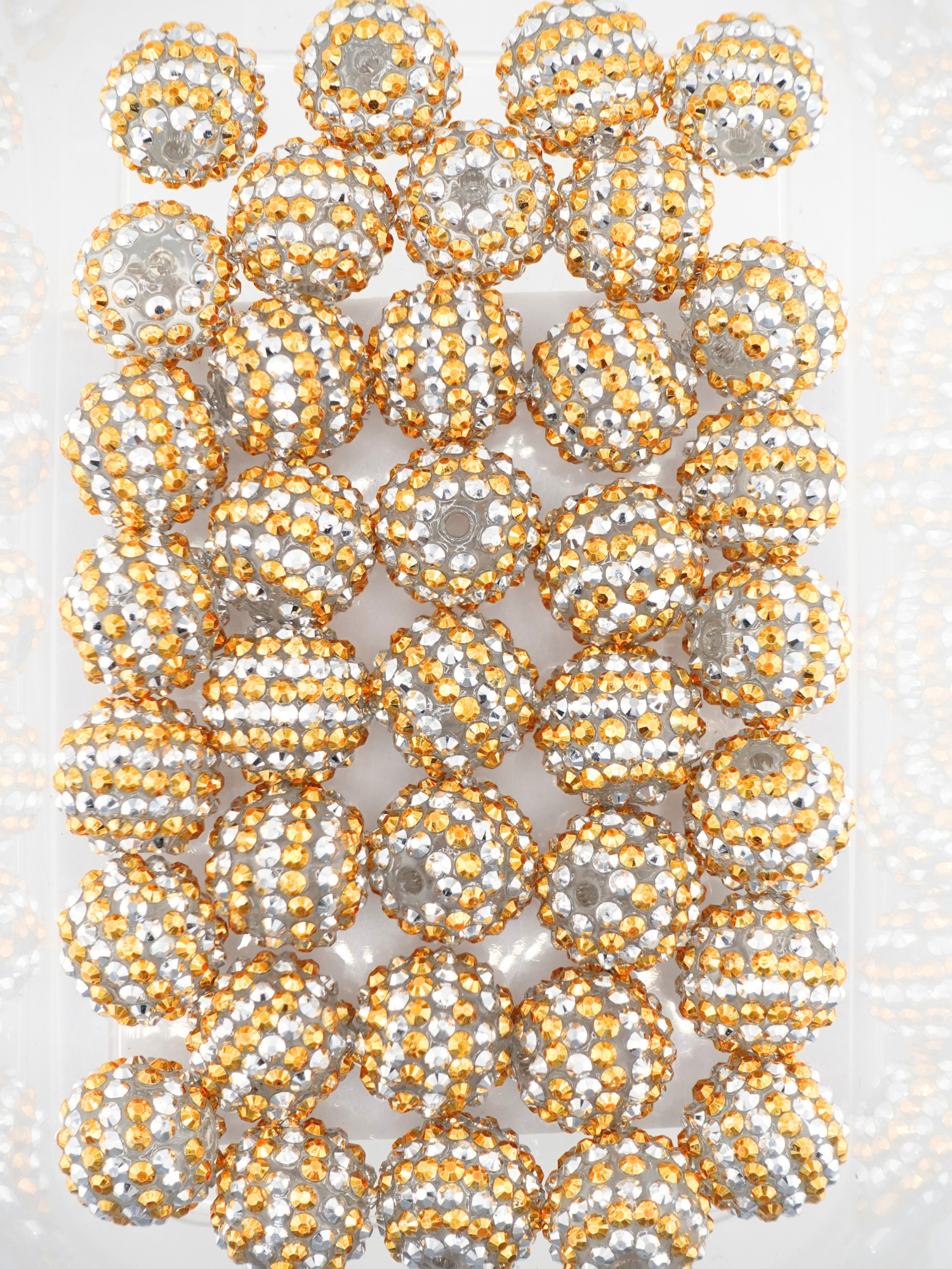 Collection of silver and gold beads with a stripe design