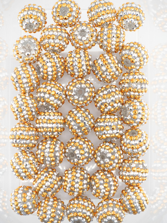 Collection of silver and gold beads with a stripe design