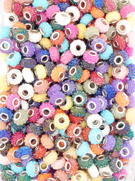 Collection of different colored spacers with a textured rose design