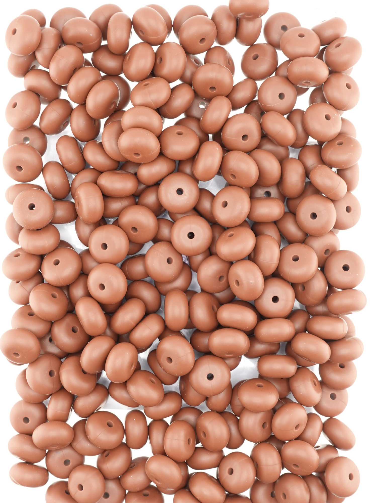 Collection of dark brown colored silicone spacers