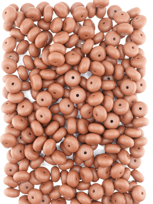 Collection of dark brown colored silicone spacers