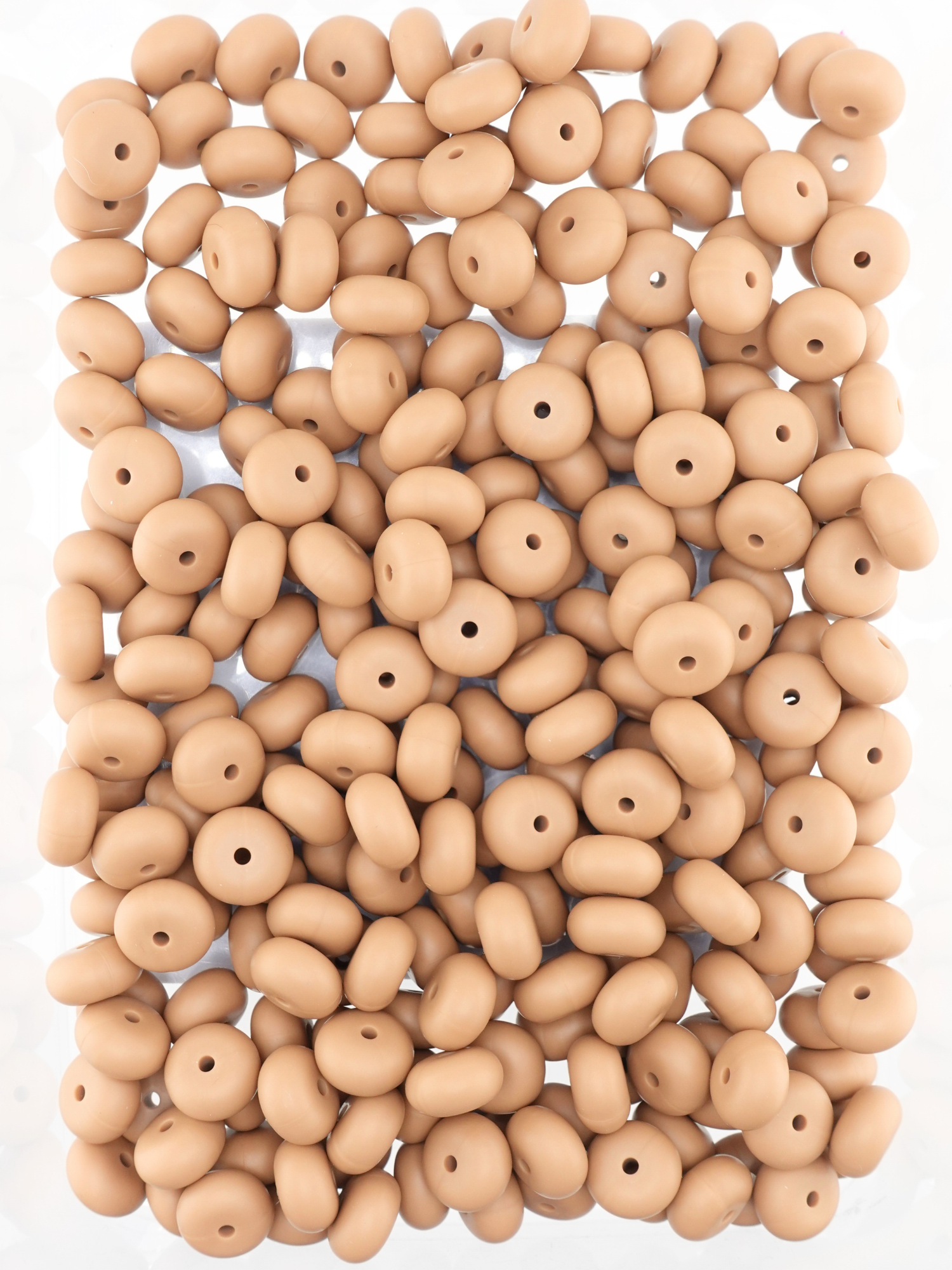 Collection of light brown colored silicone spacers