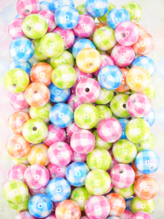 Collection of different colored beads with a plaid design