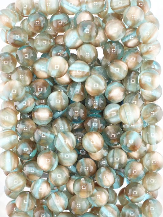 Collection of volcano beads in the colors brown and teal