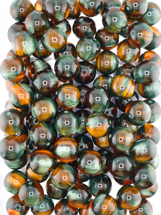 Collection of volcano beads in the colors green and amber