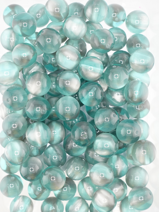 Collection of volcano beads in the colors teal and grey