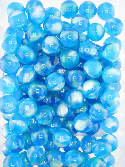 Collection of volcano beads in the colors teal and mint