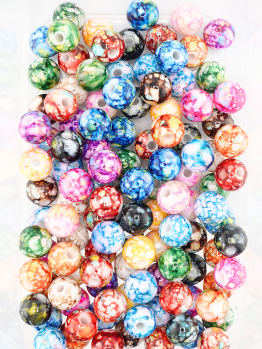 Collection of 14mm different colored beads with a water paint design